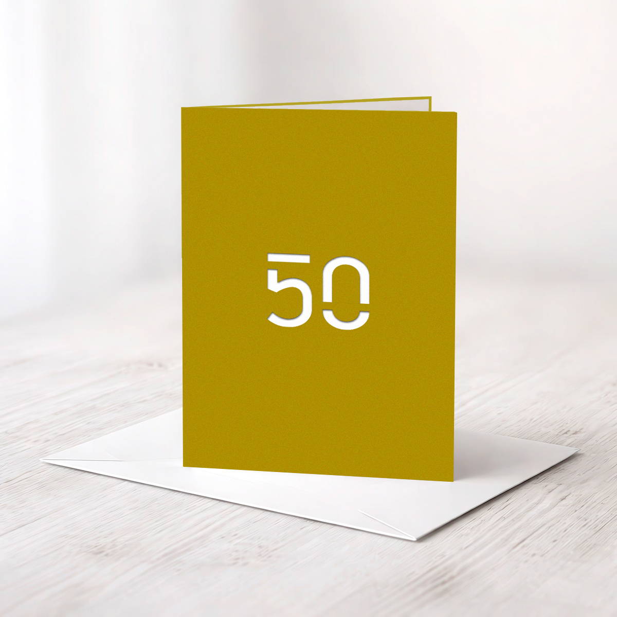 Gelaserte „50“ in Qualitätskarton Gmund metallic-gold