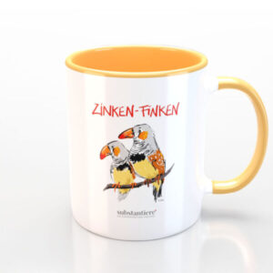 Weiße Tasse, innen gelb, mit relbem Henkel und „Zinken-Finken“-Motiv